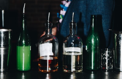 Black transparent glass bottles on the table
